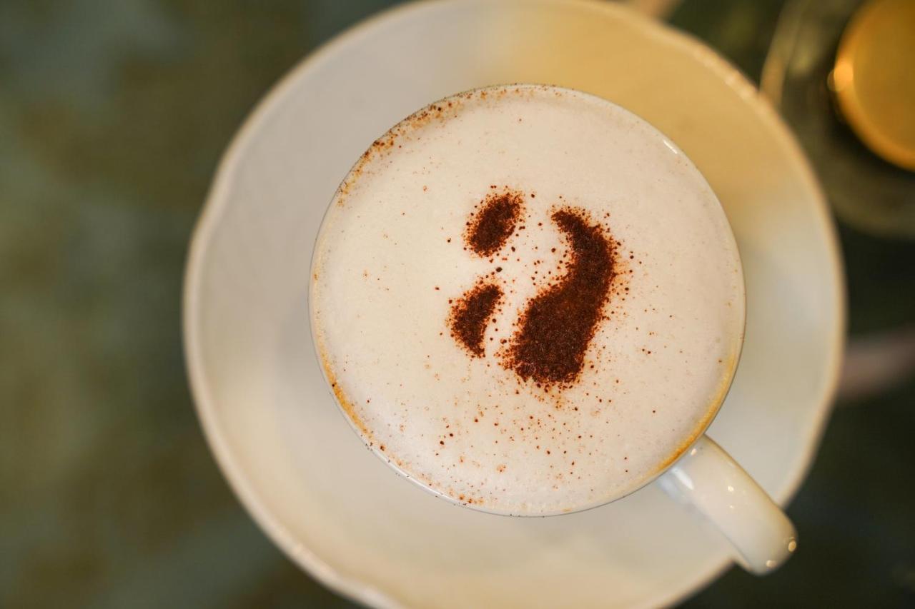 Ambiance Boutique Art Hotel Lahore Exteriör bild A cappuccino with a number 2